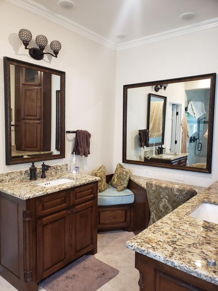 Large traditional kids bathroom in Dallas with brown cabinets, a hot tub, beige tile, an undermount sink, granite benchtops, a hinged shower door, brown benchtops, a double vanity and a built-in vanity.