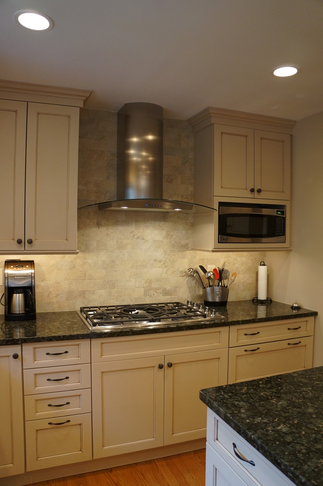 Eat-in kitchen - transitional eat-in kitchen idea in Boston with an undermount sink, recessed-panel cabinets, white cabinets, granite countertops and an island