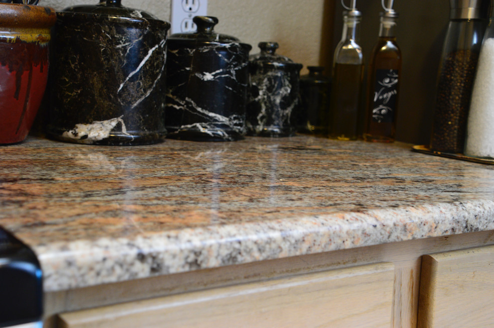 Enclosed kitchen - small rustic single-wall ceramic tile enclosed kitchen idea in Albuquerque with an undermount sink, granite countertops and no island