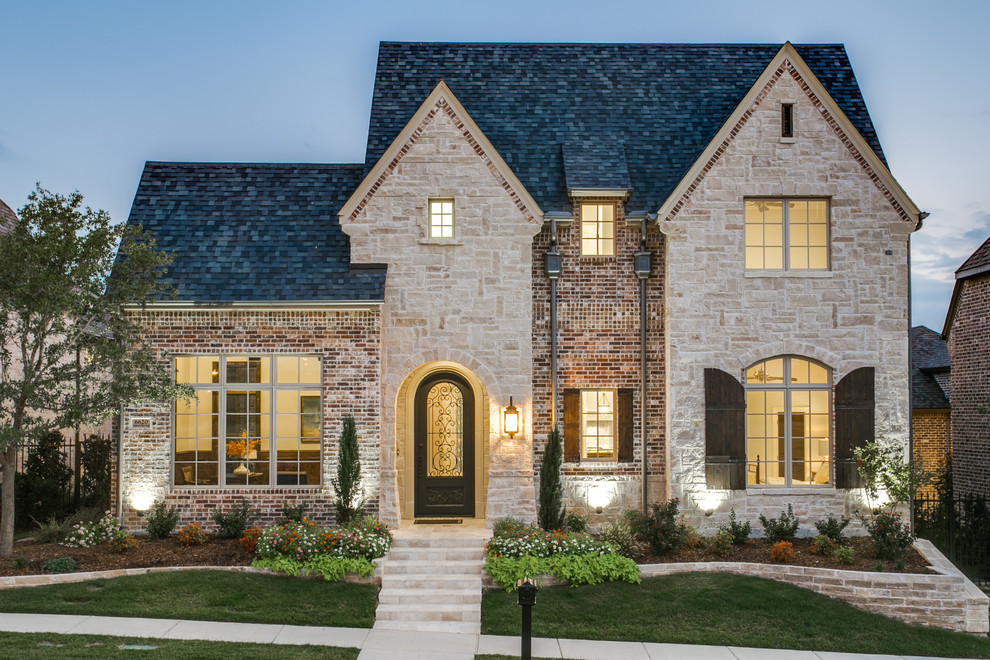 Design ideas for a traditional two-storey brick beige exterior in Dallas with a gable roof.