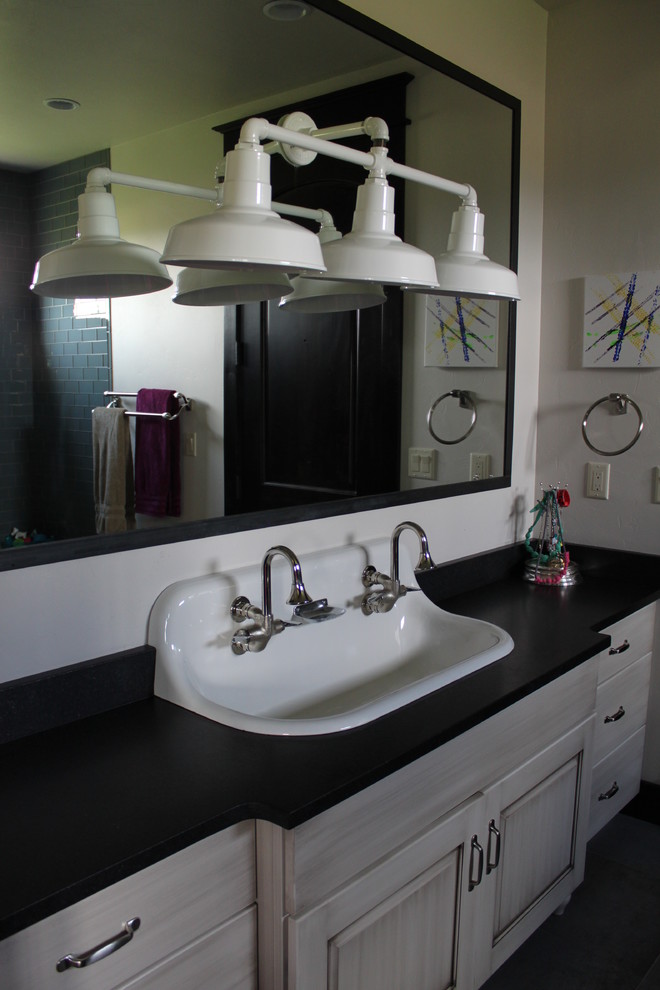 Mid-sized mountain style 3/4 home design photo with raised-panel cabinets, beige cabinets and a trough sink