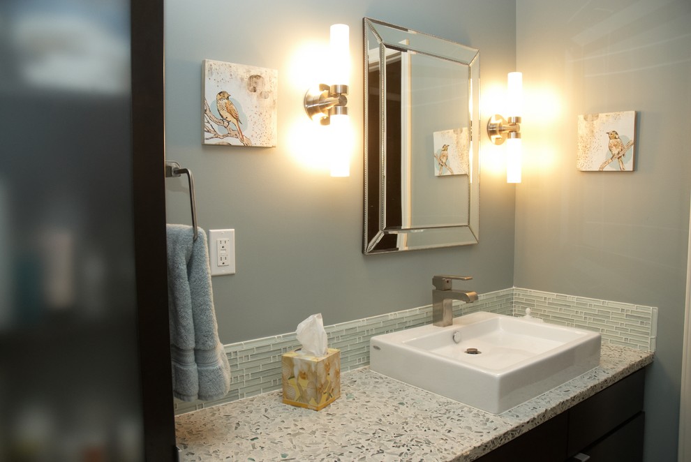 Bathroom - mid-sized transitional 3/4 blue tile, gray tile and matchstick tile bathroom idea with flat-panel cabinets, dark wood cabinets, gray walls, a vessel sink and terrazzo countertops