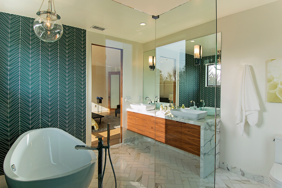 Inspiration for a contemporary blue tile bathroom remodel in Los Angeles with a vessel sink, flat-panel cabinets, medium tone wood cabinets and a two-piece toilet