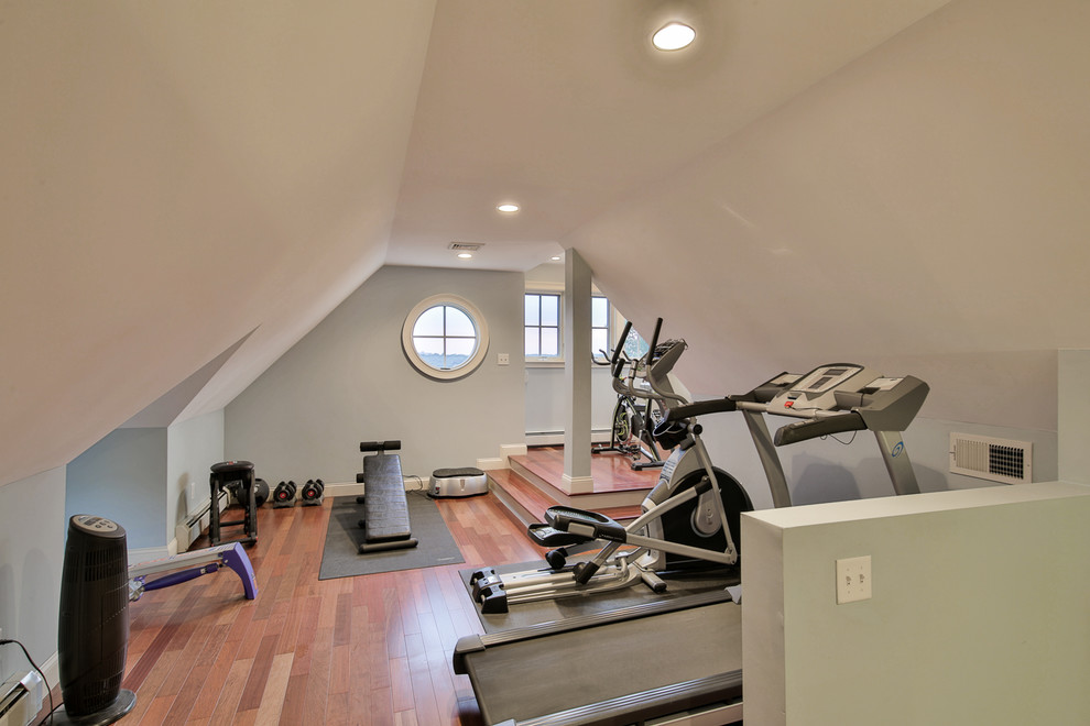 Inspiration for a home gym in Boston with blue walls.