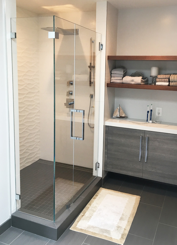 Inspiration for a mid-sized modern bathroom in San Francisco with a corner shower, white walls, ceramic floors, grey floor and a hinged shower door.