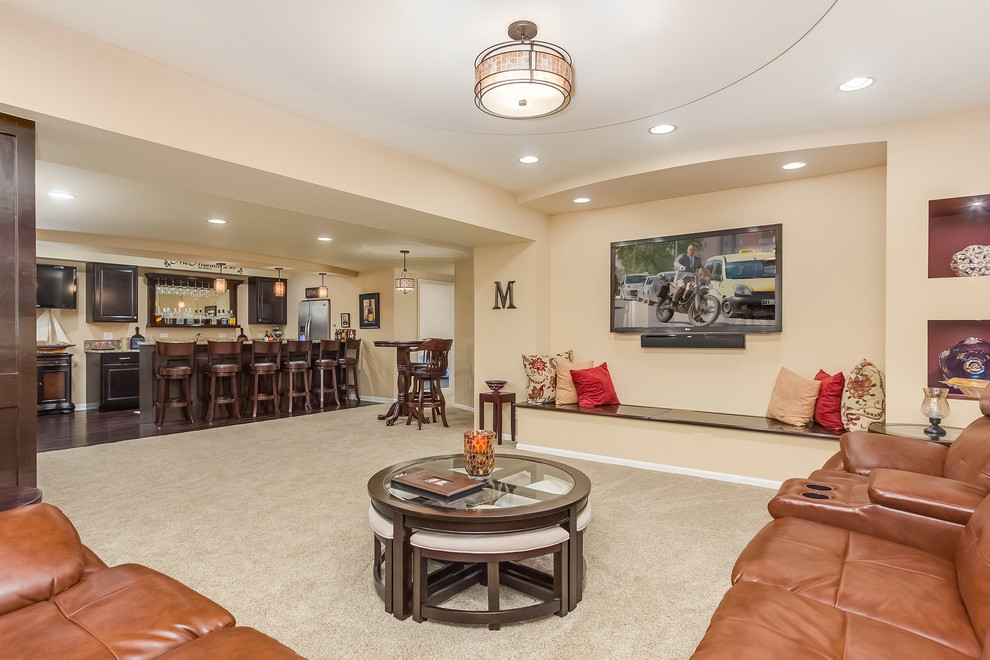 Photo of a large traditional look-out basement in Chicago with beige walls, carpet, no fireplace and beige floor.