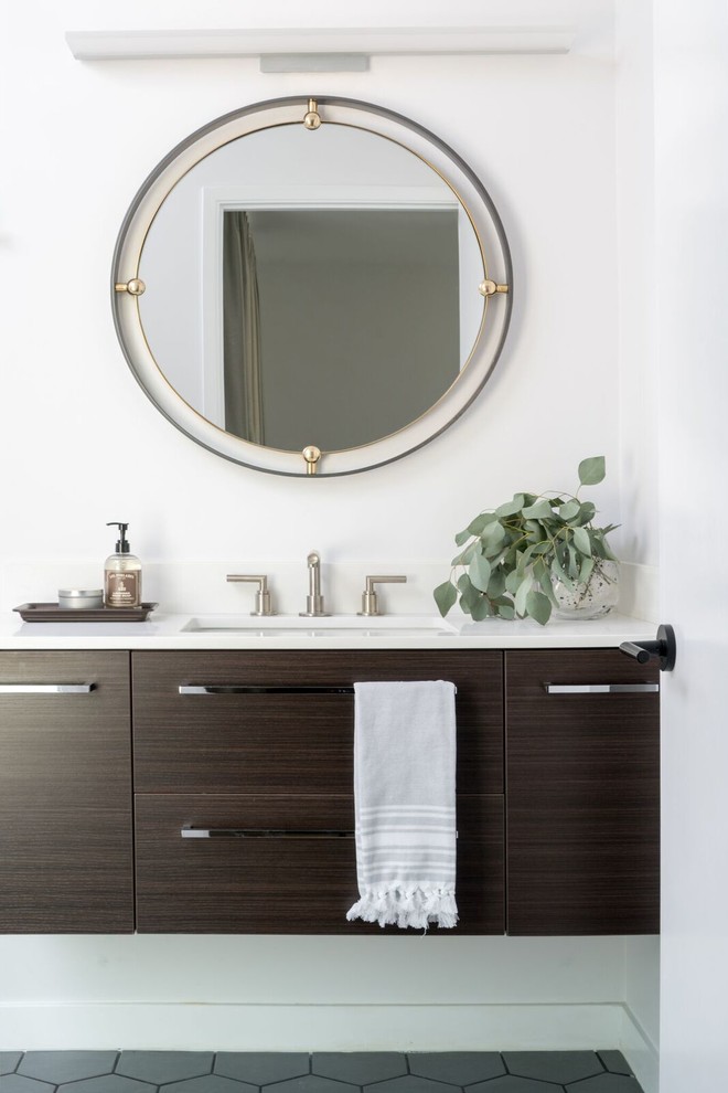 Example of a mid-sized transitional gray floor bathroom design with flat-panel cabinets, dark wood cabinets, white walls, an undermount sink and white countertops