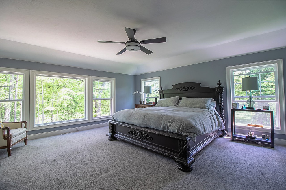 Photo of a large traditional master bedroom in Cleveland with grey walls, carpet, grey floor and coffered.
