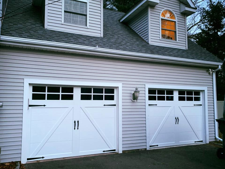 Design ideas for a large traditional attached two-car garage in Bridgeport.