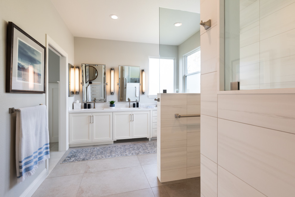 Inspiration for a large contemporary master bathroom in Sacramento with recessed-panel cabinets, white cabinets, an alcove shower, grey walls, a drop-in sink, beige floor, an open shower, white benchtops, gray tile, porcelain tile, porcelain floors and engineered quartz benchtops.