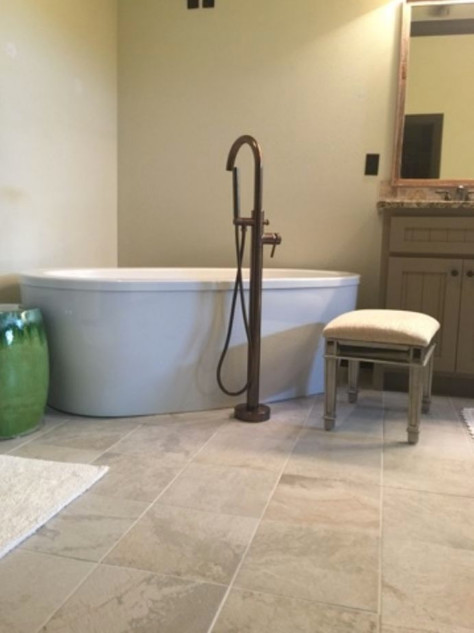 Example of a mid-sized transitional master ceramic tile and beige floor freestanding bathtub design with beaded inset cabinets, gray cabinets, a one-piece toilet, beige walls, an undermount sink and granite countertops