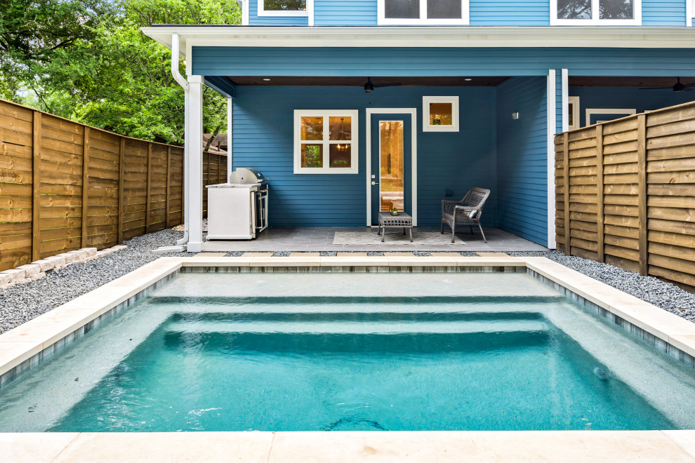 Photo of a mid-sized contemporary backyard rectangular pool in Austin with with privacy feature and gravel.