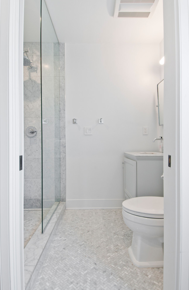 Photo of a small transitional 3/4 bathroom in Los Angeles with grey cabinets, an alcove shower, a one-piece toilet, white tile, marble, white walls, marble floors, an integrated sink, marble benchtops, multi-coloured floor and an open shower.