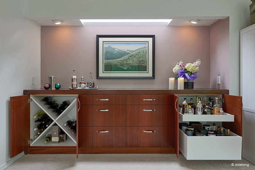 This is an example of a mid-sized contemporary single-wall home bar in Portland with flat-panel cabinets, medium wood cabinets and tile benchtops.