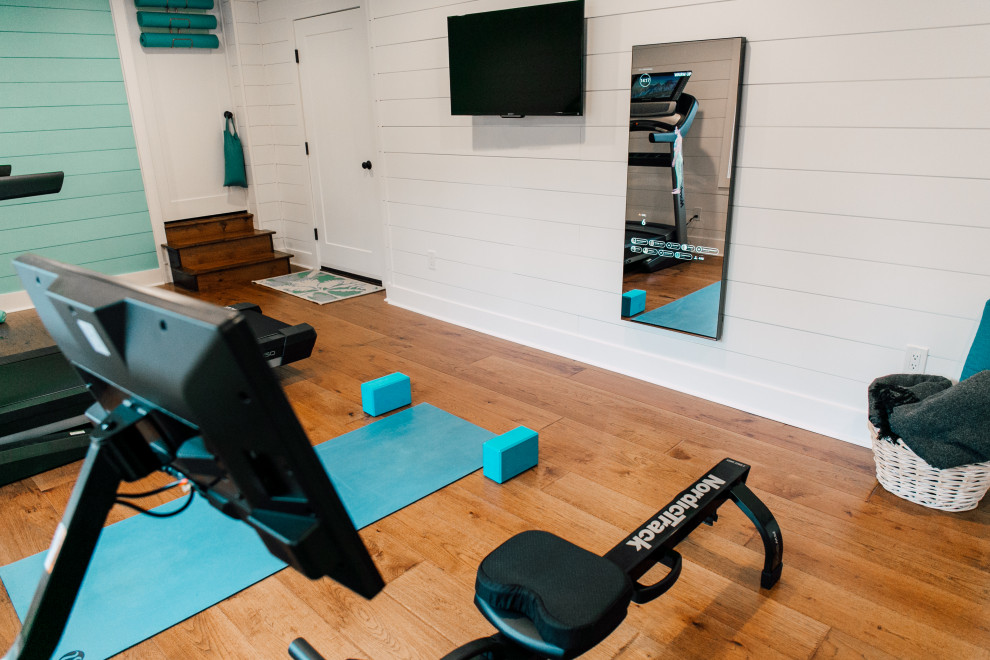 Mid-sized eclectic multipurpose gym in Seattle with white walls, medium hardwood floors, brown floor and vaulted.