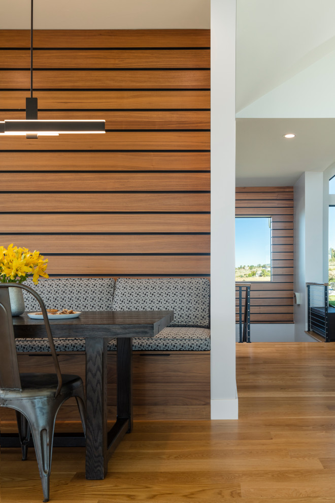 Dining room - large contemporary light wood floor dining room idea in Denver