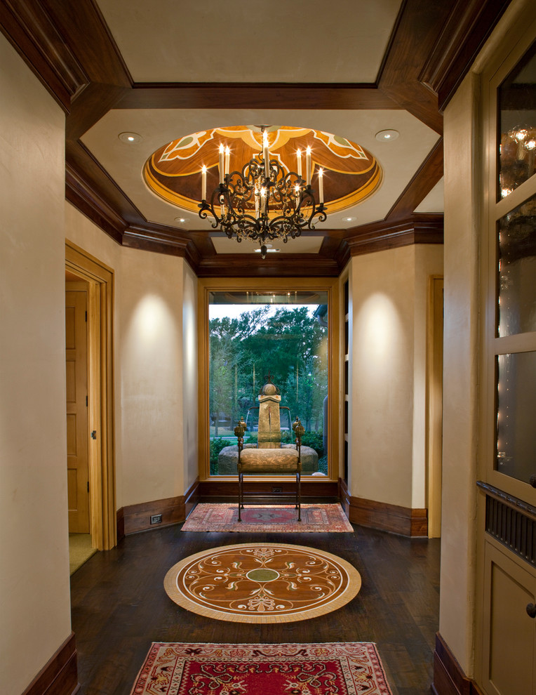 Inspiration for a traditional entry hall in Dallas with beige walls and dark hardwood floors.