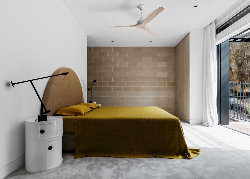Inspiration for a contemporary master bedroom in Sydney with white walls, carpet and grey floor.