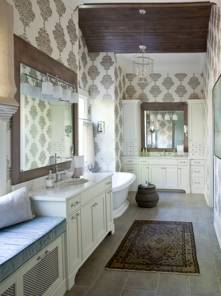 Inspiration for a country master bathroom in Atlanta with recessed-panel cabinets, white cabinets, a freestanding tub, multi-coloured walls, an undermount sink, grey floor and white benchtops.