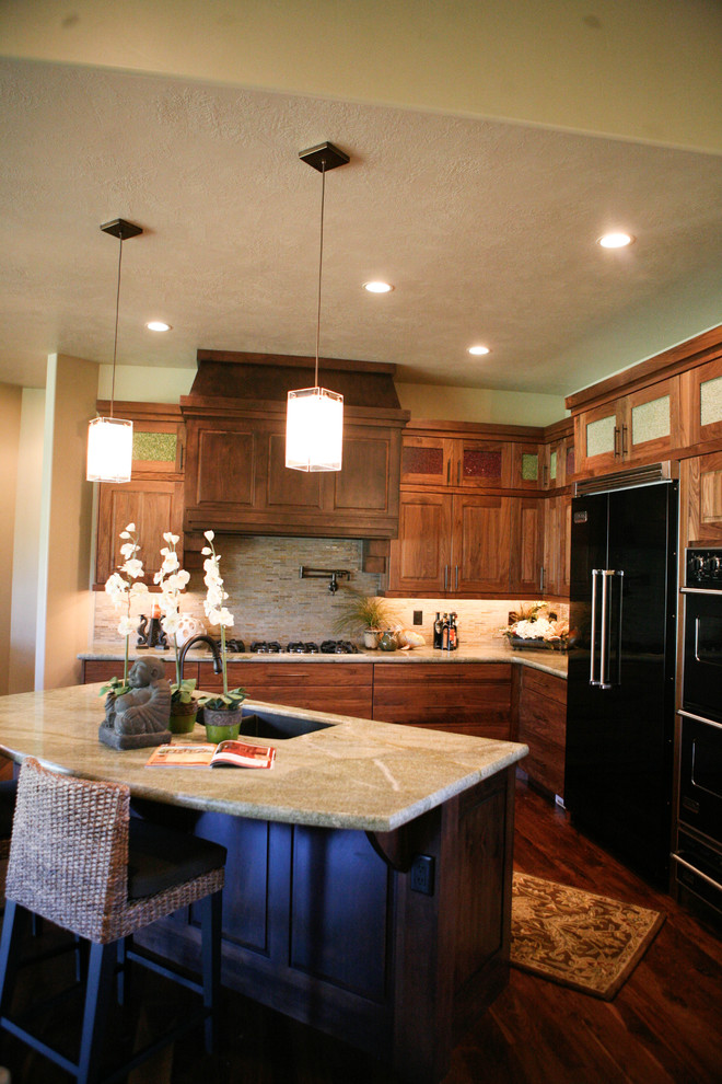 This is an example of a traditional kitchen in Other with black appliances.