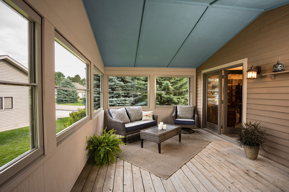 This is an example of a mid-sized contemporary backyard screened-in verandah in Other with decking.