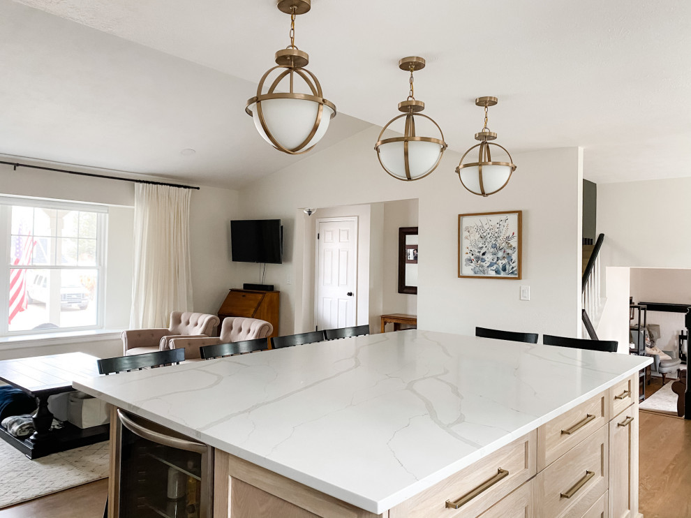 Inspiration for a large transitional l-shaped open plan kitchen in Denver with an undermount sink, shaker cabinets, white cabinets, white splashback, with island, white benchtop and coffered.