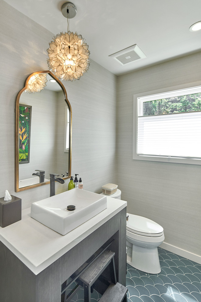 Design ideas for a large transitional powder room in San Francisco with a two-piece toilet, grey walls, ceramic floors, a vessel sink, solid surface benchtops, grey floor and white benchtops.