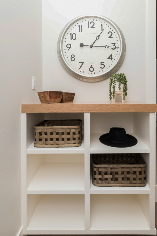 Inspiration for a mid-sized country light wood floor and beige floor mudroom remodel in Boise with gray walls