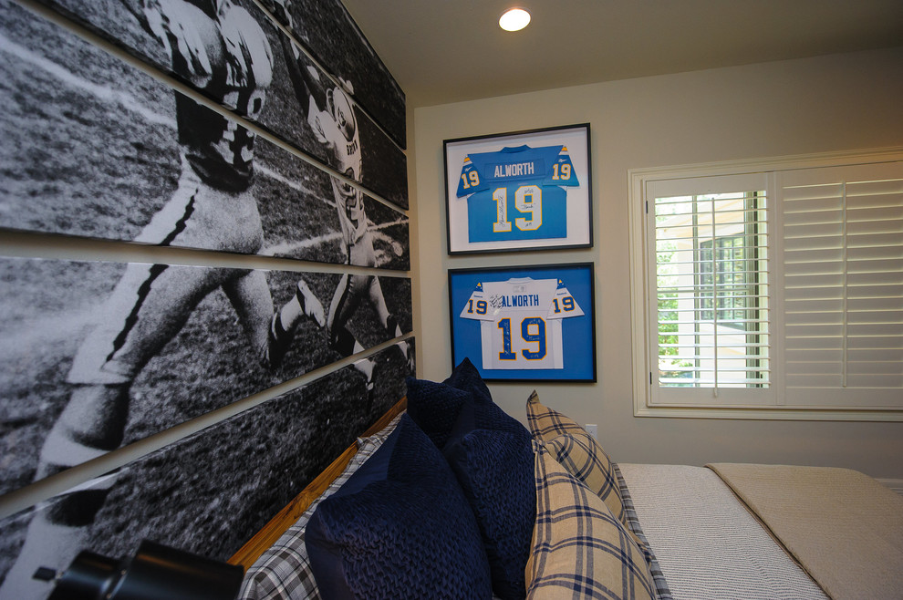 Example of a small transitional boy medium tone wood floor kids' room design in Austin with beige walls