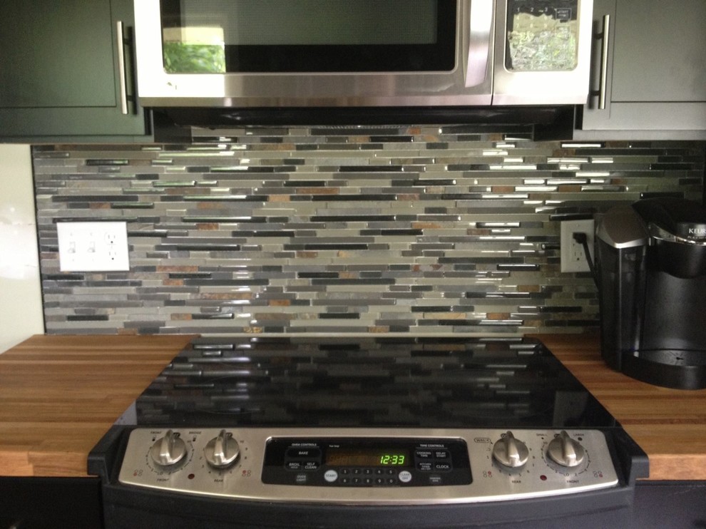Transitional kitchen photo in Raleigh with granite countertops, multicolored backsplash and matchstick tile backsplash