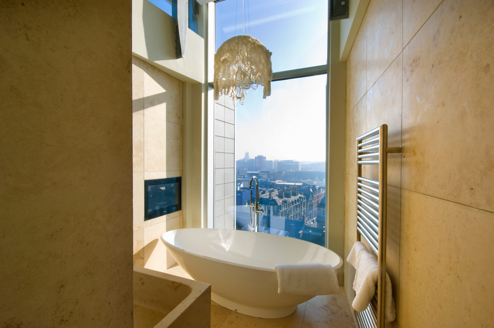 Photo of a contemporary bathroom in Miami with a freestanding tub.