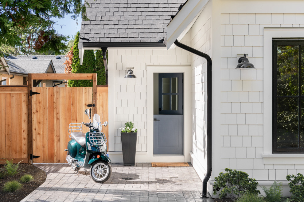 Example of a beach style home design design in Vancouver
