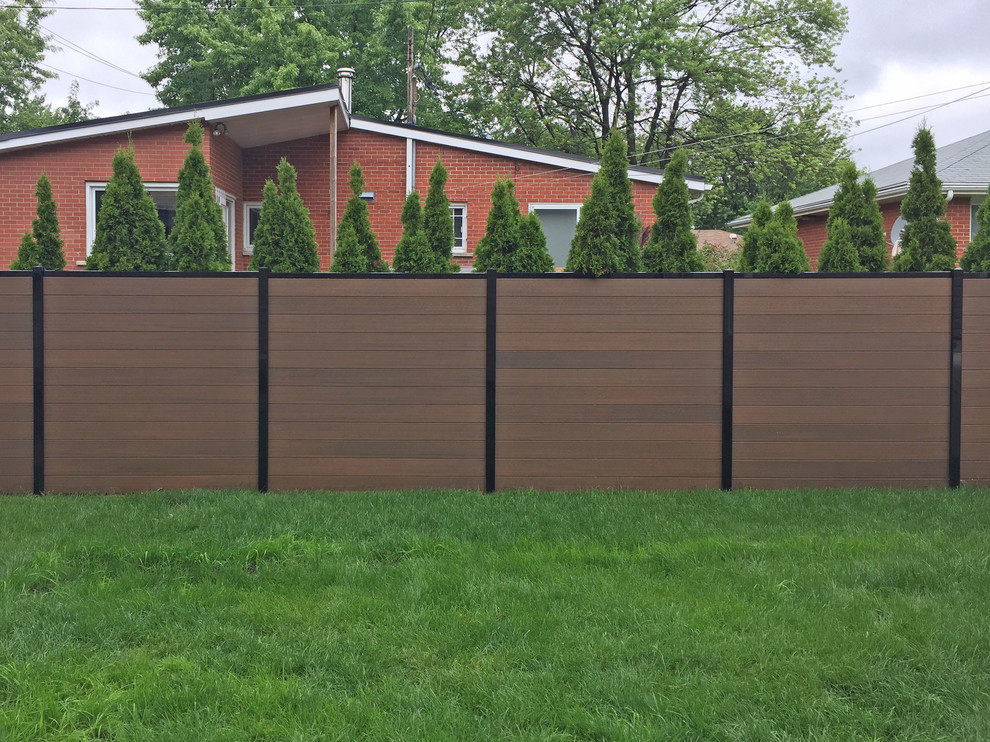 Example of a mid-sized minimalist home design design in Montreal