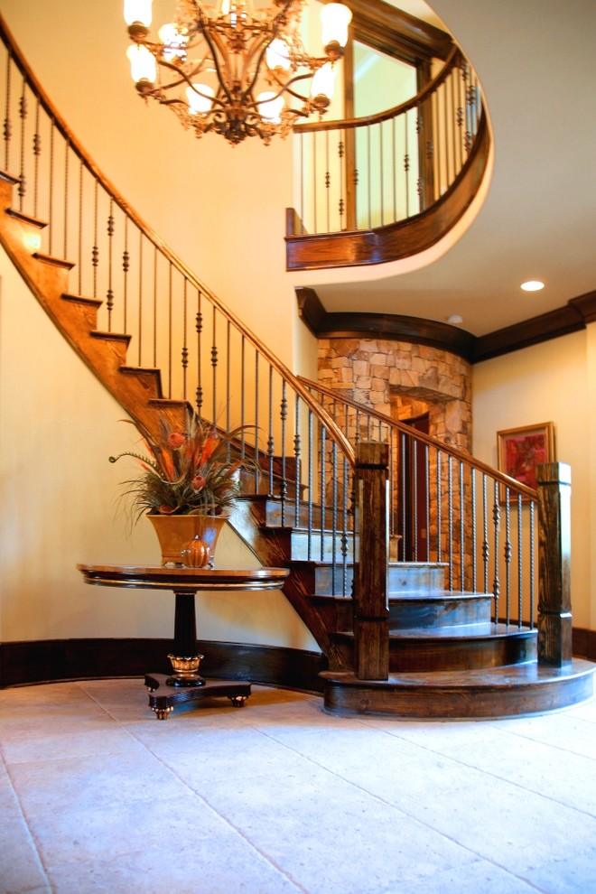 Inspiration for a modern wood curved staircase in Charlotte with wood risers.