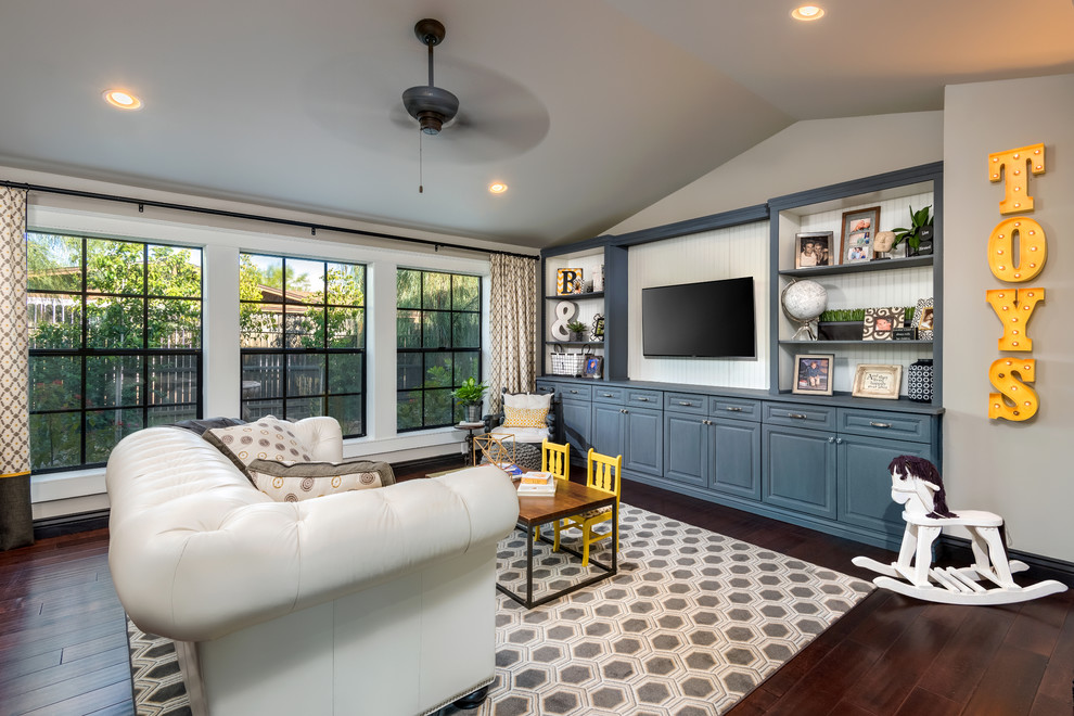 Inspiration for a large transitional open concept dark wood floor and brown floor living room remodel in Phoenix with a wall-mounted tv, multicolored walls and no fireplace