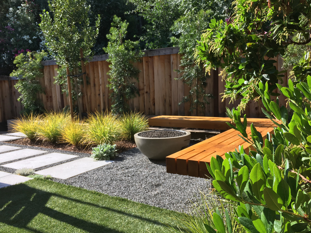 Small modern backyard full sun formal garden in San Francisco with a garden path and concrete pavers.