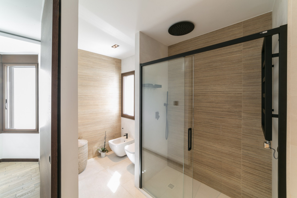 Design ideas for a mid-sized contemporary powder room in Madrid with porcelain floors.