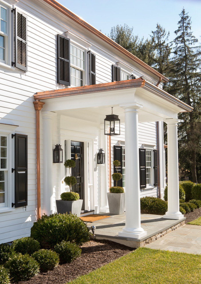 This is an example of a traditional verandah in Philadelphia with a roof extension.
