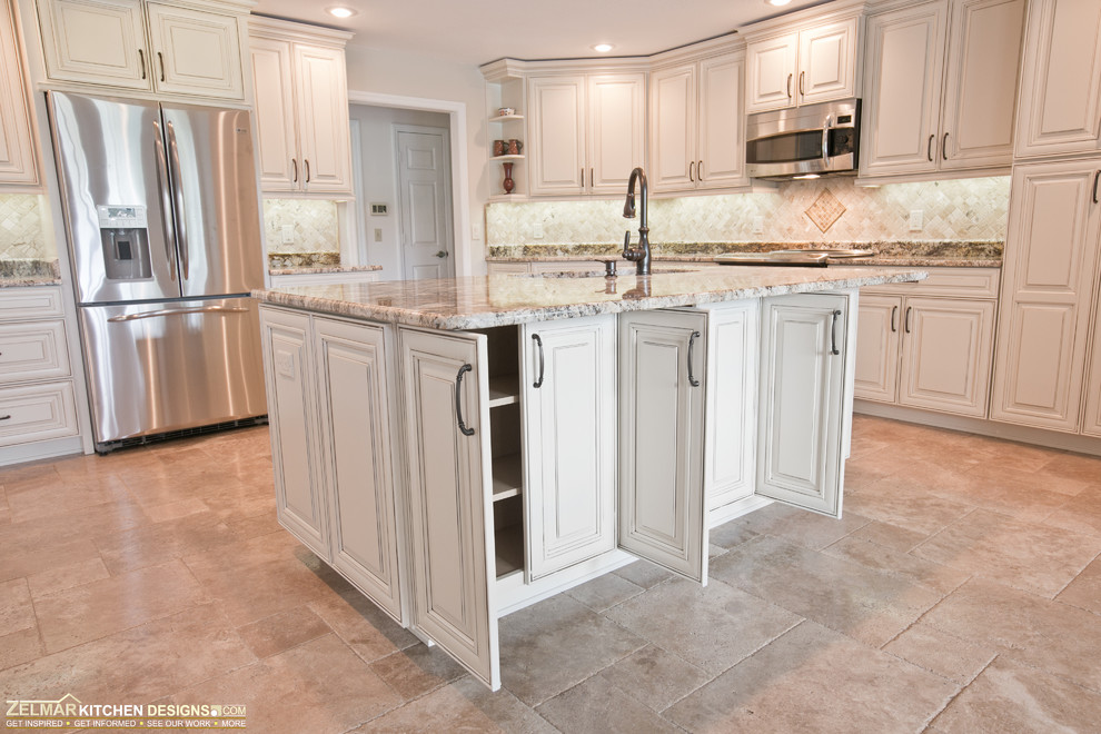 Photo of an expansive traditional u-shaped eat-in kitchen in Orlando with raised-panel cabinets, white cabinets, granite benchtops, beige splashback, stone tile splashback and with island.