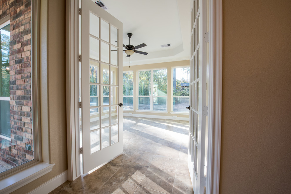 Photo of a mid-sized traditional sunroom in Houston with ceramic floors, no fireplace and a standard ceiling.