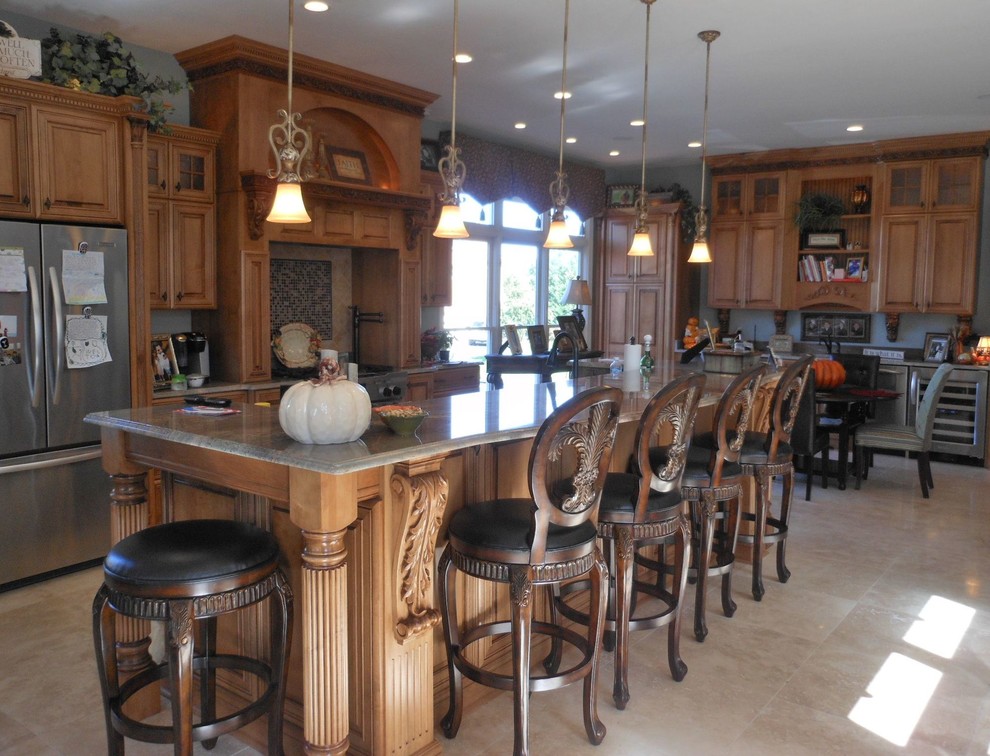 Example of a large transitional l-shaped porcelain tile open concept kitchen design in DC Metro with raised-panel cabinets, medium tone wood cabinets, granite countertops, beige backsplash, porcelain backsplash, stainless steel appliances and an island