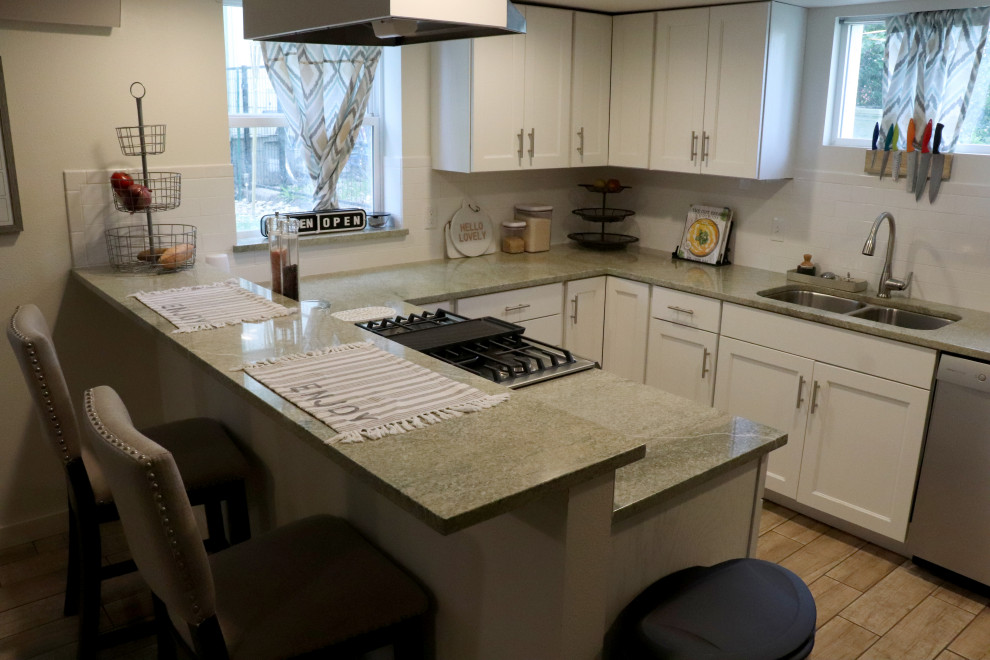 Example of a cottage kitchen design in Denver with an undermount sink and granite countertops