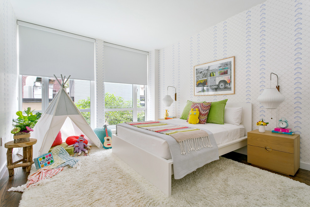 Mid-sized contemporary kids' bedroom in New York with white walls, dark hardwood floors and brown floor.