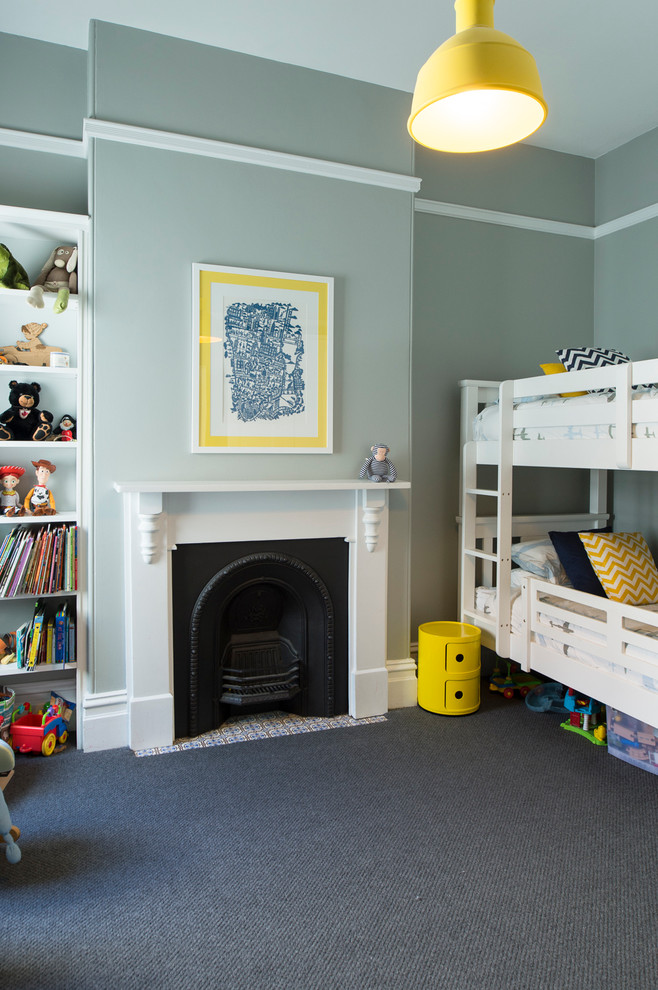 This is an example of a transitional gender-neutral kids' room in Melbourne with grey walls.