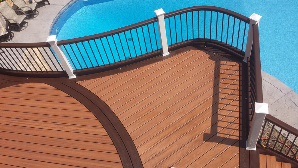 Example of a mid-sized backyard balcony deck design in DC Metro with no cover