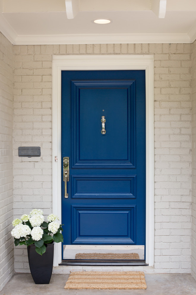 Example of a transitional single front door design in Dallas with a blue front door