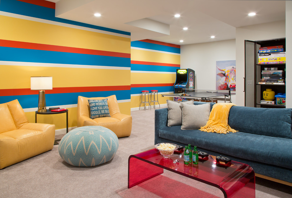 This is an example of a transitional gender-neutral kids' room in Denver with multi-coloured walls, carpet and beige floor.