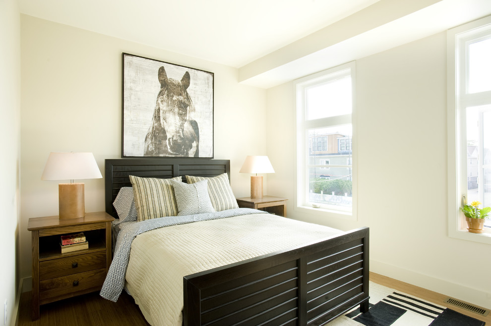 Contemporary bedroom in Boston with beige walls and medium hardwood floors.