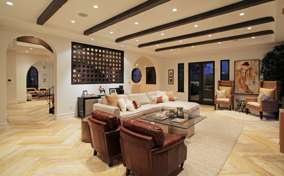 Photo of a mid-sized mediterranean formal enclosed living room in Los Angeles with white walls, light hardwood floors, no tv and beige floor.