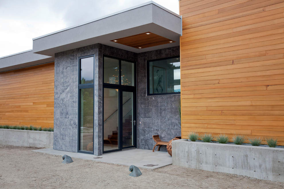 Mid-sized contemporary front door in Vancouver with concrete floors, a glass front door and a single front door.